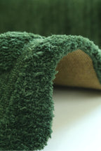 Grüner Hochflor Teppich